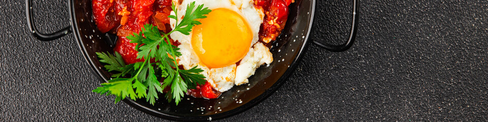Fried egg tomatoes shakshuka vegetable dish appetizer fresh delicious gourmet food background on...