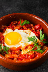 Fried egg tomatoes shakshuka vegetable dish appetizer fresh delicious gourmet food background on the table rustic food top view copy space vegetarian  food
