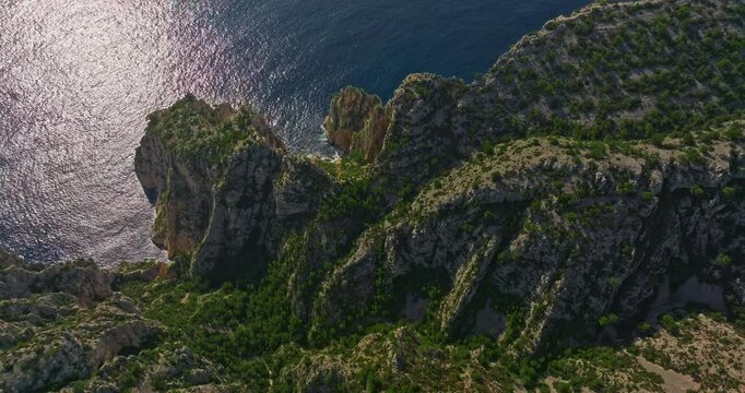 Aerial View of Calanque dEn-Vau near cassis town provence France. Breathtaking view of bay, a beautiful blue lagoon with a white sand beach, surrounded by cliffs, pines, near Marseille in France