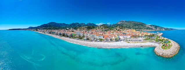 Aerial view above the colorful Village and Beaches of Menton, France on the French Riviera