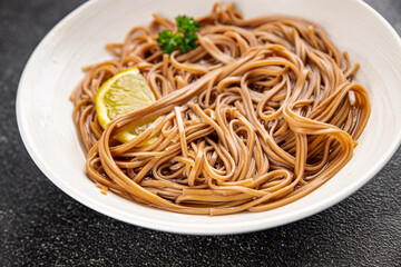 Buckwheat noodles soba in a bowl fresh dish Asian cuisine on the table rustic food top view copy space