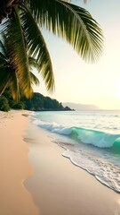 Obraz premium Tropical Beach with Palm Leaves, Sea Waves and Golden Sunset Light