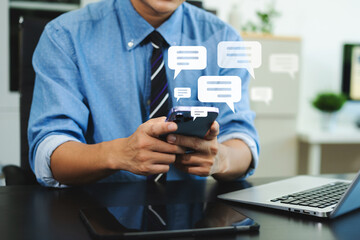 Man hands  User typing on smartphone and tablet chatting conversation in chat box icon pop up for social media marketing technology concept.