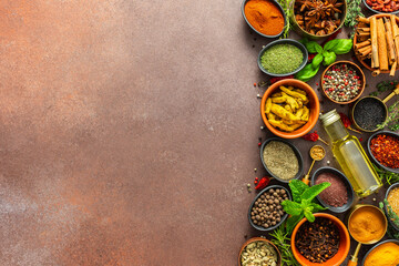 A diverse collection of vibrant spices and herbs, elegantly positioned on a brown backdrop, exuding natural beauty and a burst of fragrances