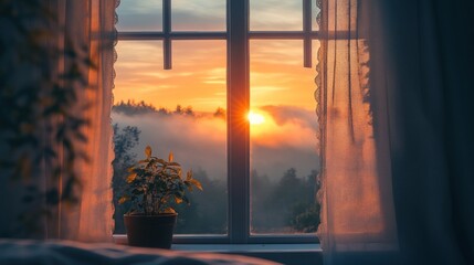 Sunrise view from a window.  A serene, peaceful morning light streams into a room
