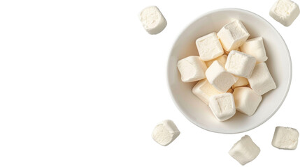 Soft marshmallows in white bowl, surrounded by scattered pieces, create delightful treat