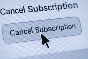 Termination concept with cursor clicking on cancel subscription button on digital screen representing end of service agreement