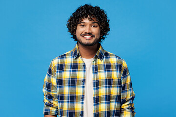 Young smiling cheerful fun satisfied positive happy Indian man he wearing yellow checkered shirt...
