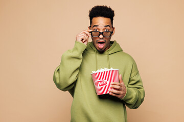 Young shocked surprised man of African American ethnicity wear green hoodie casual clothes lower 3d...