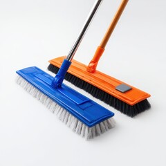 Dual Cleaning Tools for Home and Office Use Featuring Blue and Orange Brooms on a Light Background Ideal for Household Maintenance and Organization