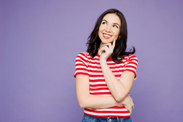 Young Caucasian woman she wear red striped t-shirt casual clothes put hand prop up on chin, lost in...
