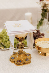 Golden Chalice with Eucharist Hosts Representing Holy Sacraments in Christianity