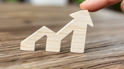 Hand pointing at growth arrow symbolizing success in 2025 financial market investments