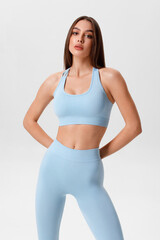 Fitness woman. Athletic girl on the gray background