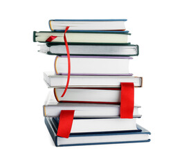 Books with red ribbon bookmarks isolated on white