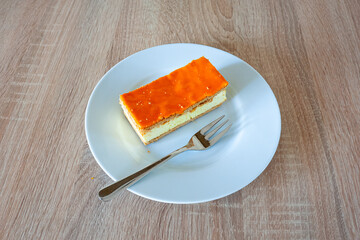 Orange colored pastry "tompouce" which is eaten in the Netherlands on King's Day on the occasion of the king's birthday.