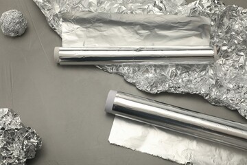 Aluminum foil on grey background, above view