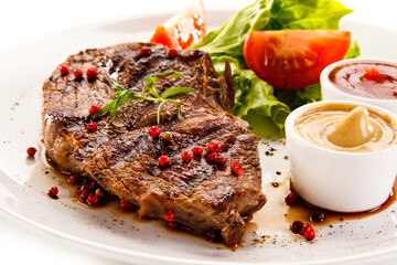 Grilled steaks and vegetables