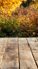Rustic Wooden Tabletop Display with Blurred Autumn Foliage Background for Product Mockups and Seasonal Presentations in Natural Light