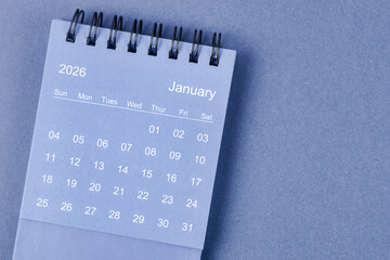 January 2026 Monthly desk calendar for 2026 year on blue background.