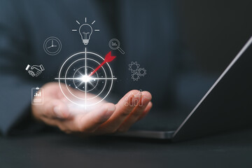 Concept of business strategy and future sustainable business finance action plan. Woman holding target board for creative and set up business objective target and success and business goals concept
