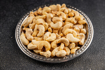 Cashew nuts natural superfood natural food vegetables dish organic product fresh tasty gourmet food background on the table rustic food top view copy space keto and paleo diet vegetarian vegan food