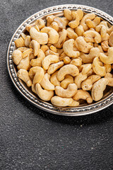 Cashew nuts natural superfood natural food vegetables dish organic product fresh tasty gourmet food background on the table rustic food top view copy space keto and paleo diet vegetarian vegan food