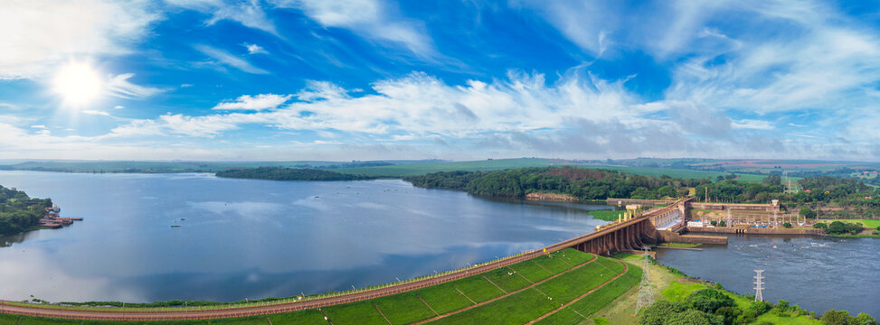 Aerial view of Dam at reservoir with flowing water, hydroelectricity power station.