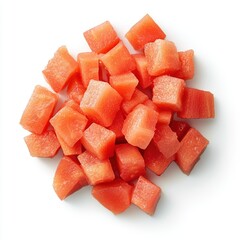 Watermelon cubes pile overhead studio shot on white background showcasing fresh fruit preparation for summer snack