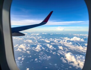 Aerial View From Airplane Window Over Cloudscape