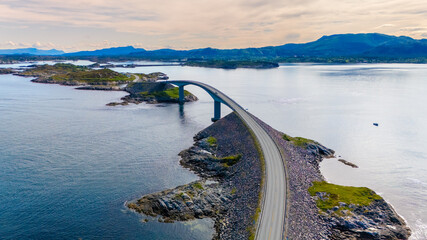 Explore a stunning bridge extending over calm waters, linking beautiful islands within Norways serene coastal region. Atlantic Ocean Road, Norway