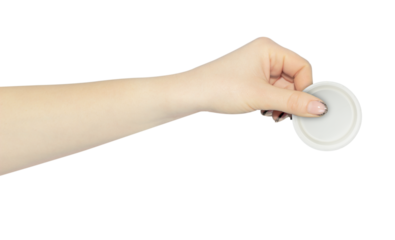 wide cap from a plastic bottle in hand, outstretched hand with cap from a plastic bottle isolated from background	