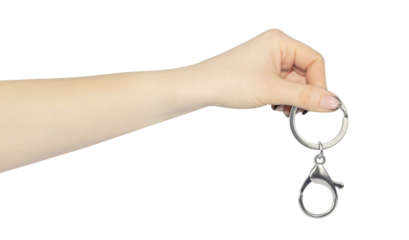 carabiner for carrying keys in hand, outstretched hand with carabiner for carrying keys isolated from background