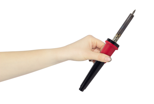 old soldering iron in hand, outstretched hand with  soldering iron isolated from background
