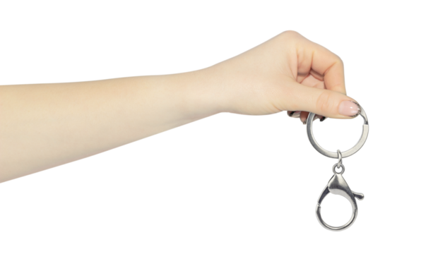 carabiner for carrying keys in hand, outstretched hand with carabiner for carrying keys isolated from background