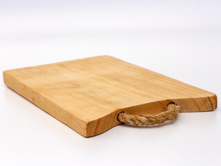 Square wooden cutting board with white background. Cooking utensils.