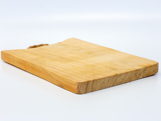 Square wooden cutting board with white background. Cooking utensils.