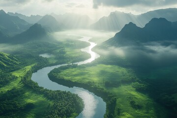 Aerial view of a river winding through a lush green valley with mountains