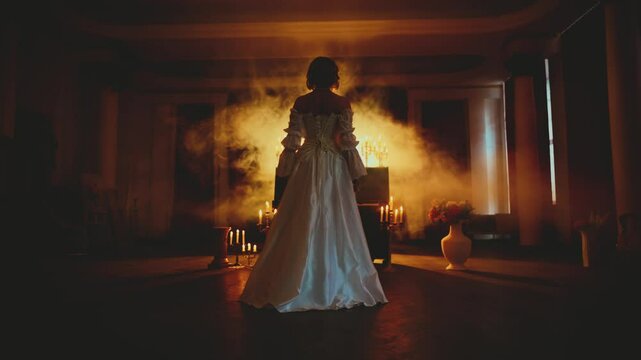 Gothic mystery sexy woman queen walking in dark night ball room full smoke, Fairy girl hand hand touching piano key. Fantasy princess Victorian style luxury vintage white long dress back rear view 4k
