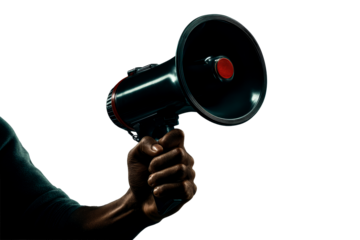 Hand holding a megaphone during a public demonstration in daylight