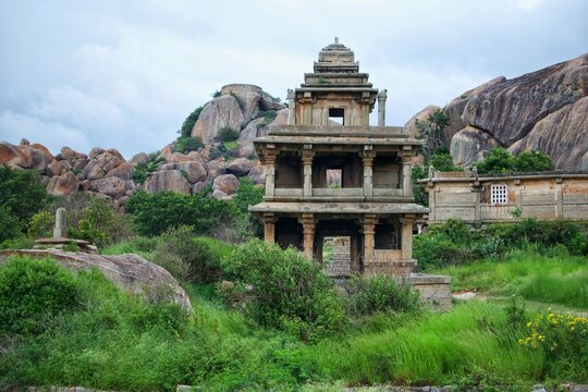 Ancient Stone Temple with Rocky Backdrop in Chitradurga Fort
