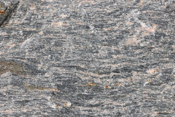 Gray granite stone texture close-up view