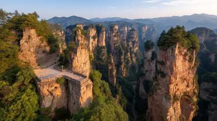 Fototapeta premium The glass bridge in surreal Zhangjiajie gives a breathtaking and dizzying view, inducing vertigo as it overlooks the vast and deep canyon below
