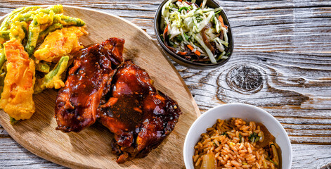 Chicken thighs in tamarind sauce with tom yum wok fried rice