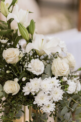 Flowers and Green Branches Adorning Church Interior for First Holy Communion Mass