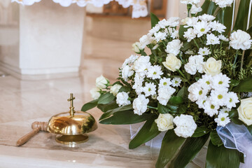 Flowers and Green Branches Adorning Church Interior for First Holy Communion Mass