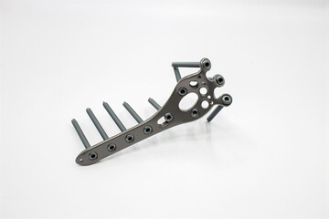 A Proximal Tibial Posterior plate implant with screws, designed for orthopedic use, showcasing precision
