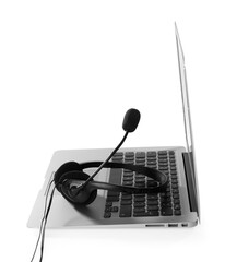 Headset with microphone and laptop on white background