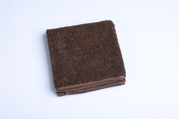 Clean towel on white background, above view