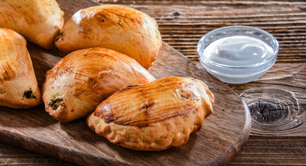 Composition with a plate of oven-baked pierogi